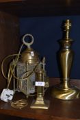 A mixed lot of brass including table lamp, isle of man horse brass,candle stick and ceiling light.