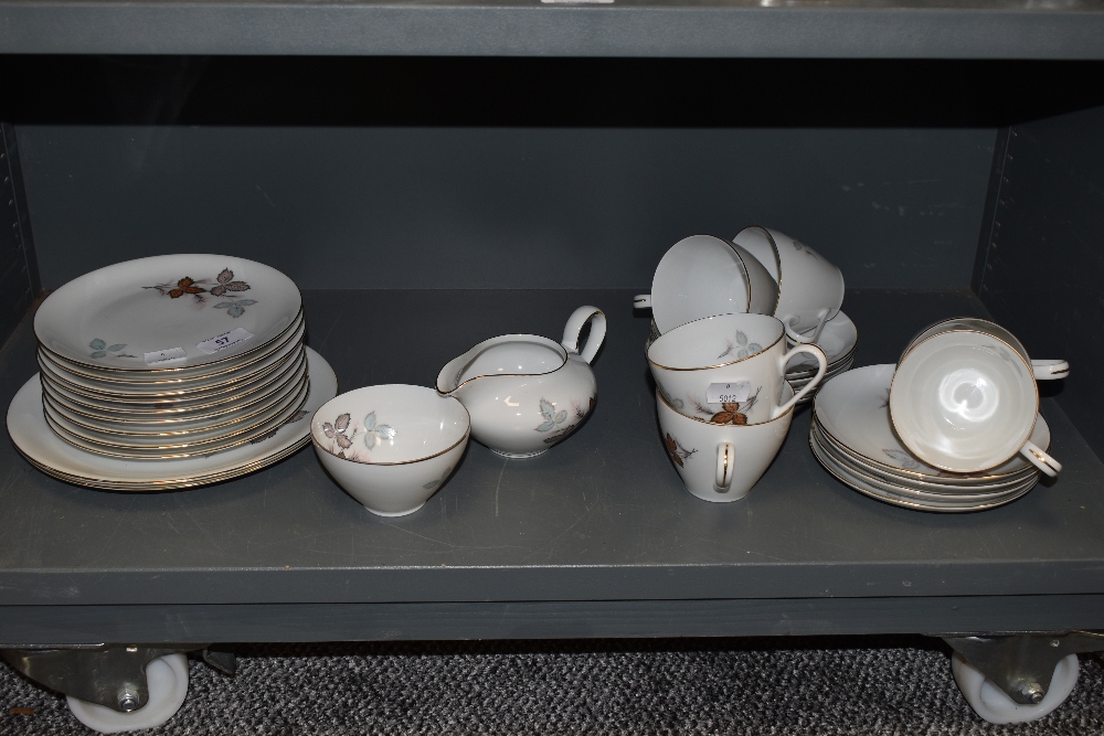 A collection of vintage plates ,cups and saucers , sugar basin and jug having transfer print of