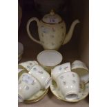 A collection of wedgwood s123 coffee cups and saucers and coffee pot, having cream ground with