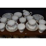 A collection of around thirty two pieces of Paragon Bridal rose, including cups and saucers, side