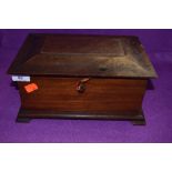 A vintage lockable mahogany box with key.