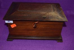 A vintage lockable mahogany box with key.