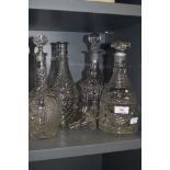 Four vintage glass decanters.