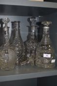 Four vintage glass decanters.