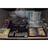 A variety of vintage boxed cutlery sets amongst which are mother of pearl handled knifes and