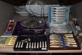 A variety of vintage boxed cutlery sets amongst which are mother of pearl handled knifes and