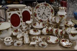 A varied lot of Royal Albert old country roses amongst which are planters, photo frames, cups and