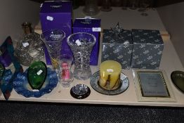 An assortment of glass and crystal items including photo frames, two Edinburgh crystal vases and