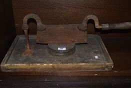A primitive antique guillotine with block,possibly for cheese,meat or bread, charming age related
