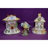 Two Coalport cottages and a Beswick blue tit.