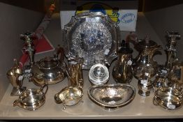 A selection of plated flat ware including tea pots, sugar sifters,candle sticks and more.