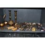 A collection of vintage brass and flat ware including souvenir spoons, sugar sifting spoons and