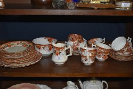 A collection of Wellington china having transfer pattern in russet tones with hand tinted floral and