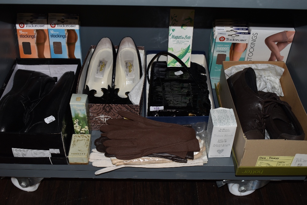 A mixed collection of vintage and retro items including stockings, gloves, shoes,bag, perfume and