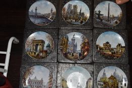 A collection of display plates having French scenes and similar.