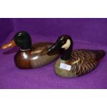 Two painted cedar decoy ducks by Thomas Chandler one Mallard Drake,the other a Canada Goose, both