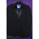 A selection of mens suit jackets and trousers.