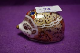 A Royal Crown Derby paperweight Bramble Hedgehog with gold stopper