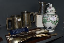 A mixed lot containing pewter tankards, oriental lidded jar, and a selection of flat ware