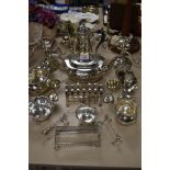 A varied lot of plated items including tea and coffee pots, toast rack, knife rests and more.