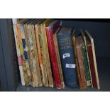 An assortment of vintage books including cookery and Rupert bear.