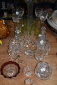 An assortment of glass including cut glass bowls, perfume bottle napkin rings and similar.