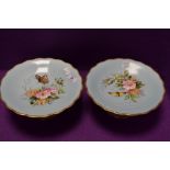 Two vintage cake stands having duck egg blue ground,gilt edging and hand painted dog rose and fern