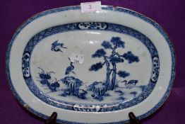 An antique meat or similar charger plate Chinese export hard paste with hand decorated fantasy scene