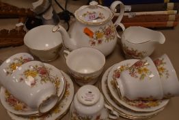 A collection of Colclough Amanda cups and saucers, tea pot, jug and sugar basin, around twenty one