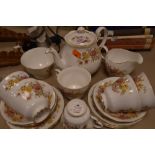 A collection of Colclough Amanda cups and saucers, tea pot, jug and sugar basin, around twenty one
