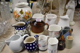 A selection of jugs and a Portmeirion vase.