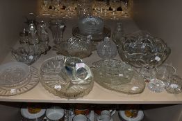 A collection or vintage glass including cake stand, plates,bowls ad more.