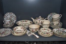 A selection of tea and dinner wares in and Indian tree design mixed names and brands