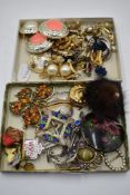 A selection of costume jewellery earrings and brooches