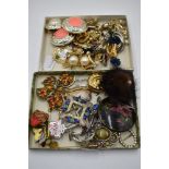 A selection of costume jewellery earrings and brooches