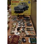 A selection of vehicle badges, key rings, and other items, including Jaguar bonnet mascot. of