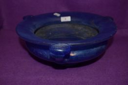 An antique art nouveau iridescent mottled blue bowl having triple handle and footed base 29cm across