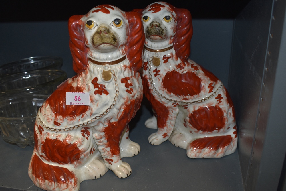 A pair of antique Staffordshire flatback figures of spaniels