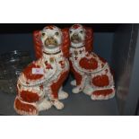 A pair of antique Staffordshire flatback figures of spaniels