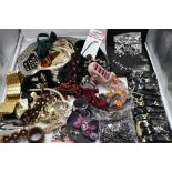 A selection of fashion items including hair slides, head bands, skull buckle, ring holder, bow ties,