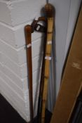 Thee vintage walking canes/ sticks and a ladies golf putter, made in Edinburgh.