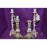 Two vintage ceramic candle sticks having cherubs to base and floral decoration AF, also included are