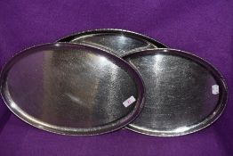 A selection of three Arts and Crafts graduated dishes of oval form by Keswick school of industrial