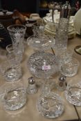 A collection of glassware amongst which are a decanter with plated handle, rose bowls and cruet.
