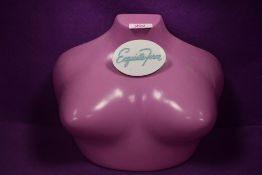 An 'Exquisite form' plastic shop mannequin advertising bust.