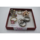 Seven assorted white metal dress and band rings stamped 925 including multi pearl, cubic zirconia,