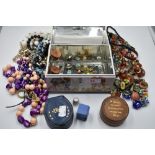 A Bluebird confectionery tin modelled as a chest containing a selection of costume jewellery