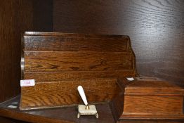 A vintage wooden desk top correspondence rack, a money box and a pen holder.