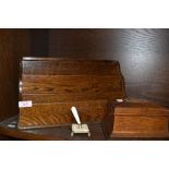 A vintage wooden desk top correspondence rack, a money box and a pen holder.