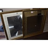 A retro wall mirror having leaf motif to border and a framed dove foil picture.